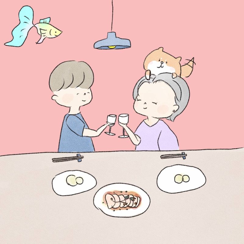 食卓で乾杯するふたりとペットのイラスト